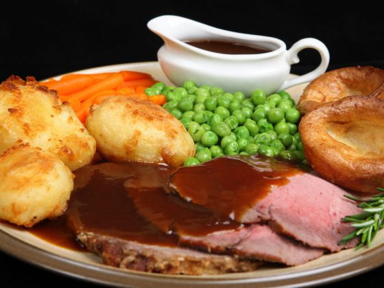 British roast beef dinner with Yorkshire puddings.